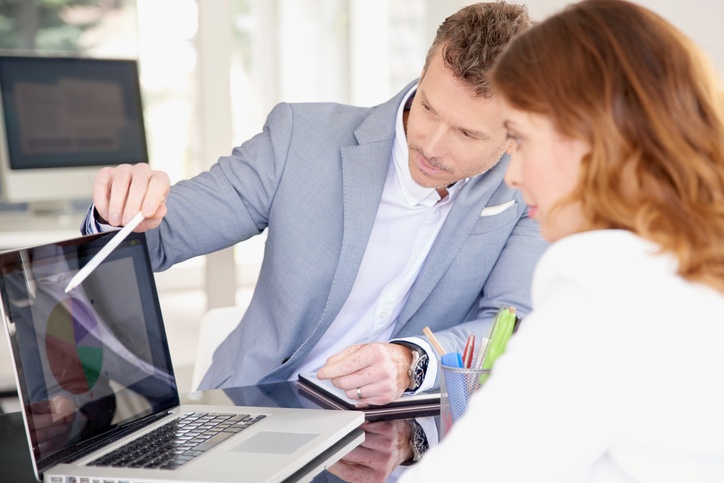 Businessman and businesswoman working together in the office
